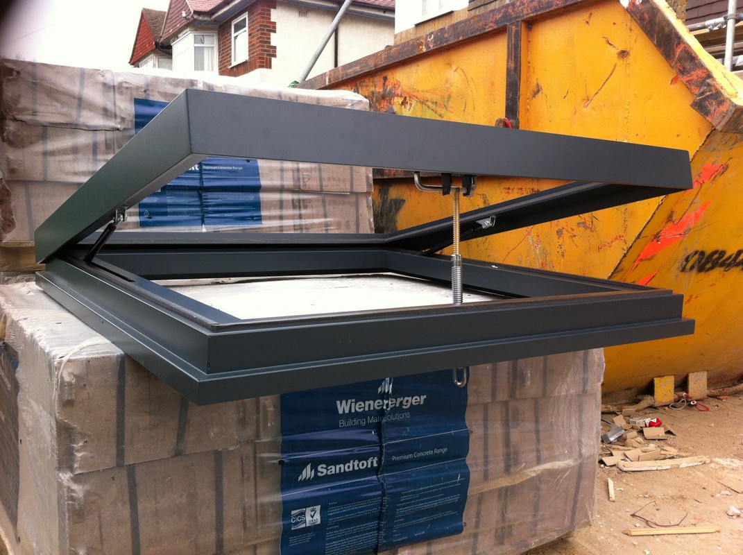 Opening flat roof skylight in anthracite grey installed in Thame