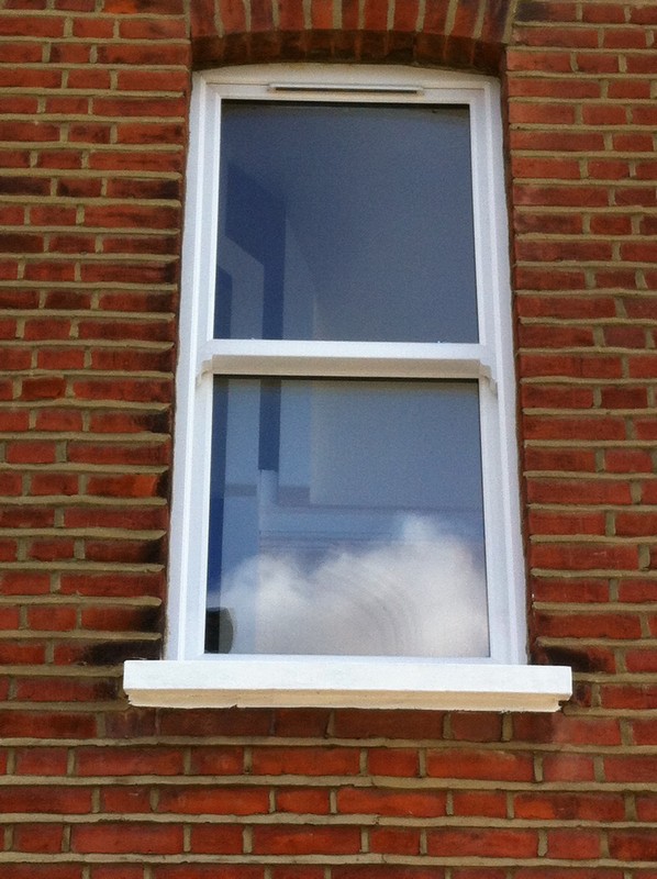 uPVC sash window on Victorian red brick house in Thame